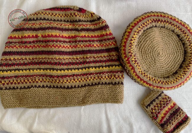 Hand knit woollen tea cosie set with a base, teapot cover and a flap to hold the handle