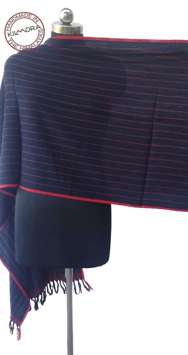 Merino wool stole in deep navy blue with thin horizontal pin stripes in red shown on a mannequin.