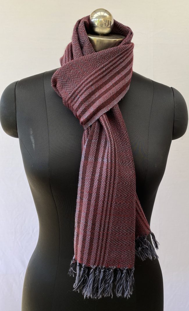 Herringbone and diamond weave overlaid with graduated stripes of merlot and blush pink.