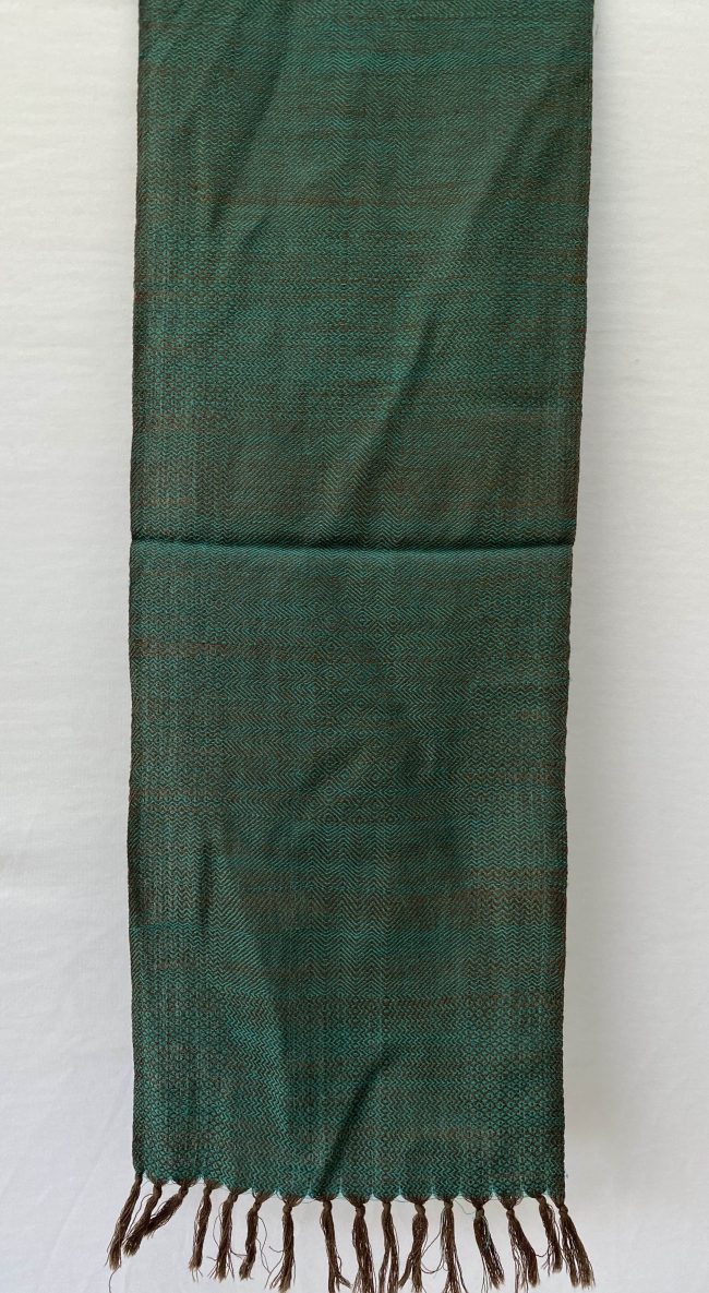 Pure merino wool scarf woven with patterns in iridescent teal with pecan brown