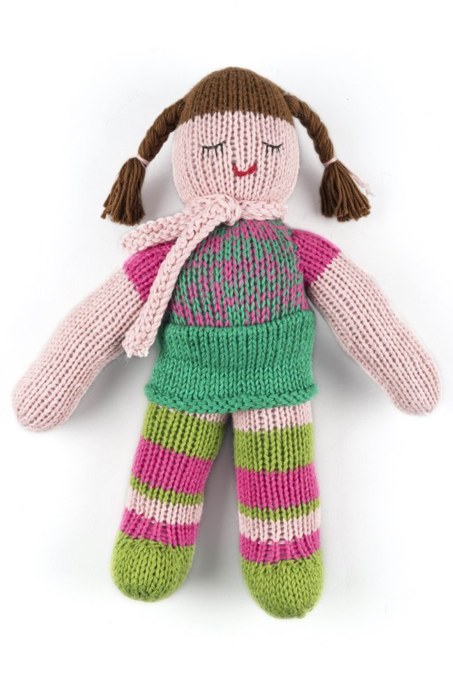 Hand-knit cotton doll with green and pink stockings, green skirt and a pink top