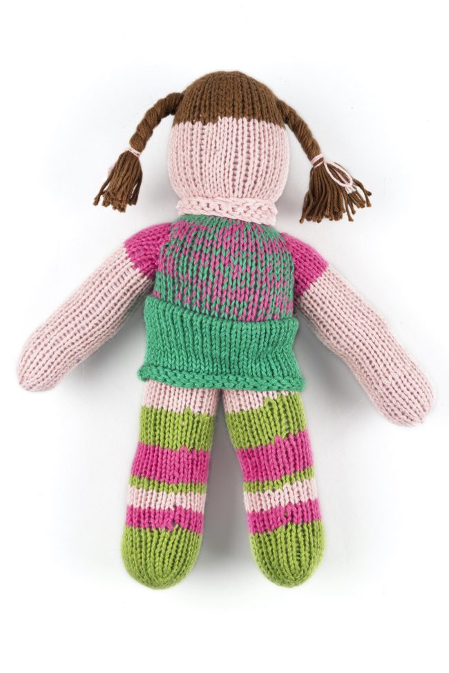 Hand-knit cotton doll with green and pink stockings, green skirt and a pink top