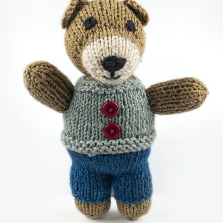 Hand-knit toy bear with dark blue trouser, light blue vest with red buttons