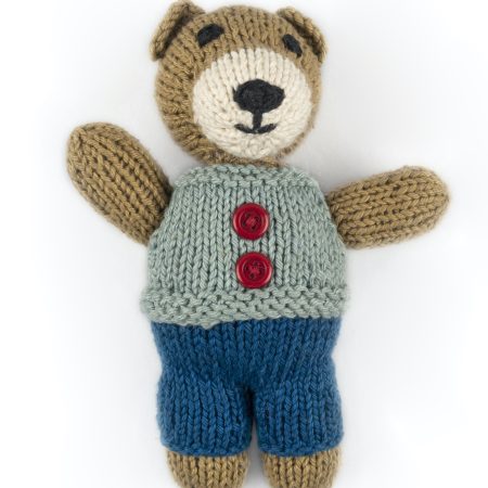 Hand-knit toy bear with dark blue trouser, light blue vest with red buttons