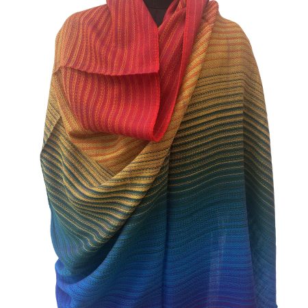 Pure merino wool handwoven shawl in gradation shades mimicking a rainbow - from indigo, blue, green, yellow, orange to red