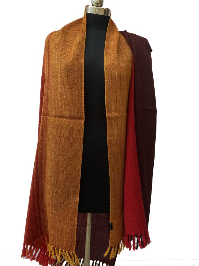 Meirno wool handwoven shawl in gradtion with shades ranging from deep maroon to crimson and tangerine