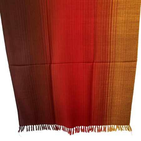 Meirno wool handwoven shawl in gradtion with shades ranging from deep maroon to crimson and tangerine