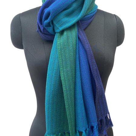 Merino wool handwoven stole in gradation in shades of royal blue, azure, sapphire, ultramarine and tiffany blue