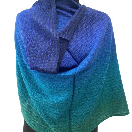 Merino wool handwoven stole in gradation in shades of royal blue, azure, sapphire, ultramarine and tiffany blue