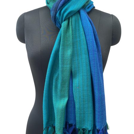 Merino wool handwoven stole in gradient weave in shades of emerald green, ultramarine blue and azure