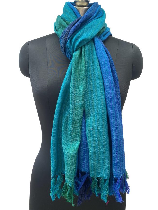 Merino wool handwoven stole in gradient weave in shades of emerald green, ultramarine blue and azure