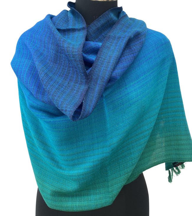 Merino wool handwoven stole in gradient weave in shades of emerald green, ultramarine blue and azure