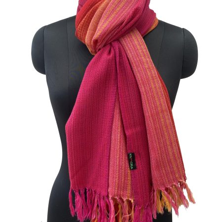 Handwoven merino wool stole in gradation in shades of scarlet, pomegranate and ruby red with a hint of citrus yellow