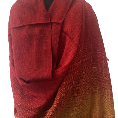 Handwoven merino wool shawl in gradation with shades from deep apricot to tangerine and ending in mahogany