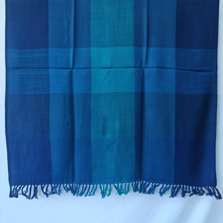 Merino wool shawl in bold blue checks in shades of aquamarine, royal blue and Egyptian blue