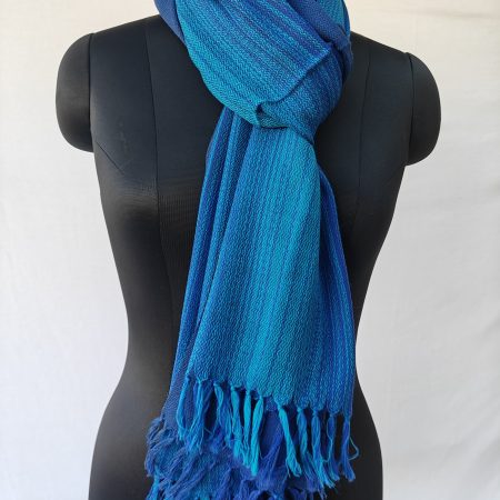 Ombre shades in this merino wool stole. Of arctic icy blue and blazing sapphire