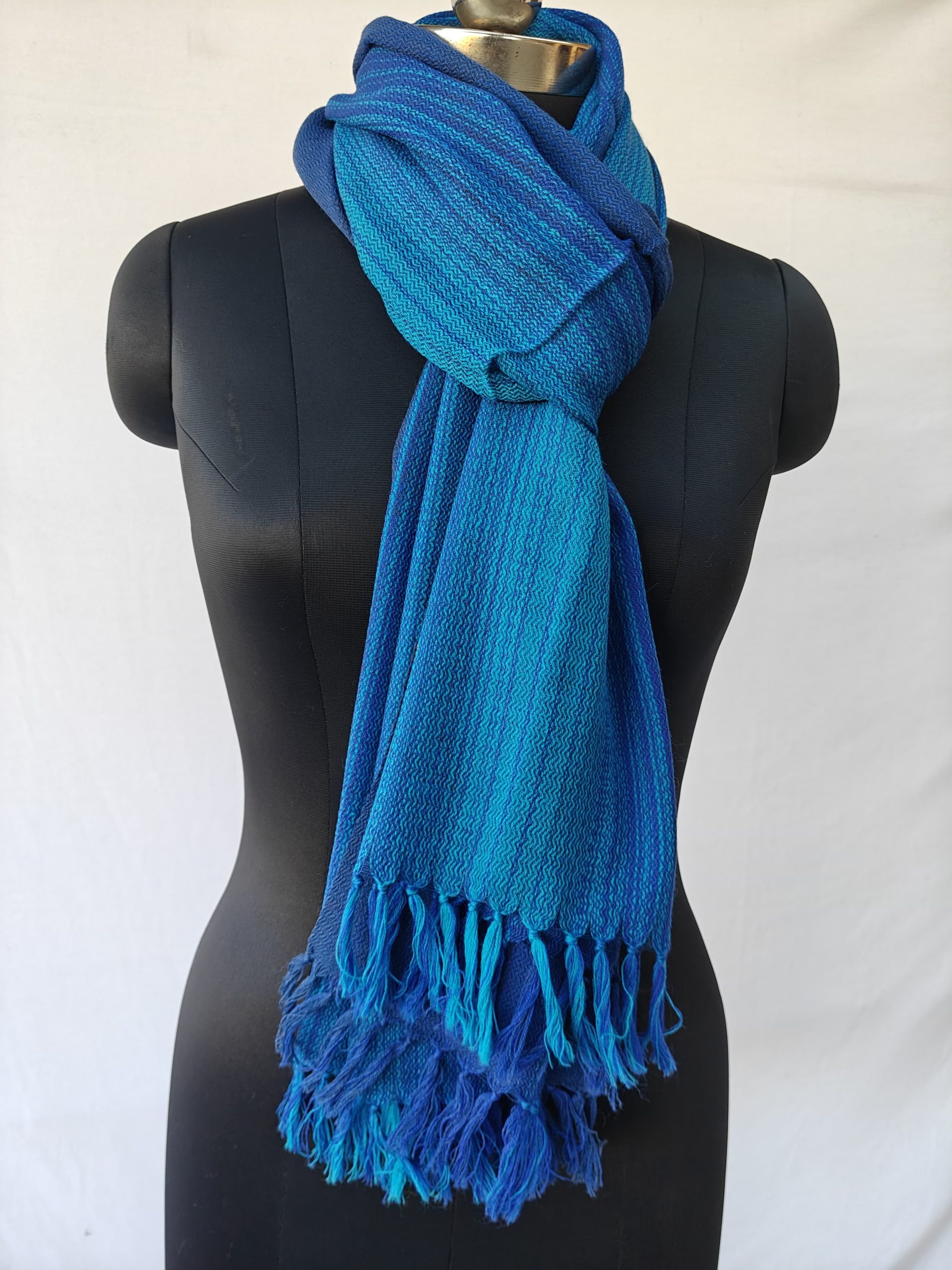 Ombre shades in this merino wool stole. Of arctic icy blue and blazing sapphire