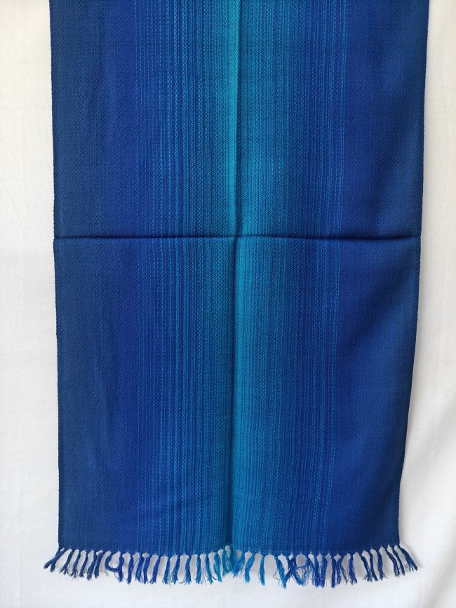 Ombre shades in this merino wool stole. Of arctic icy blue and blazing sapphire